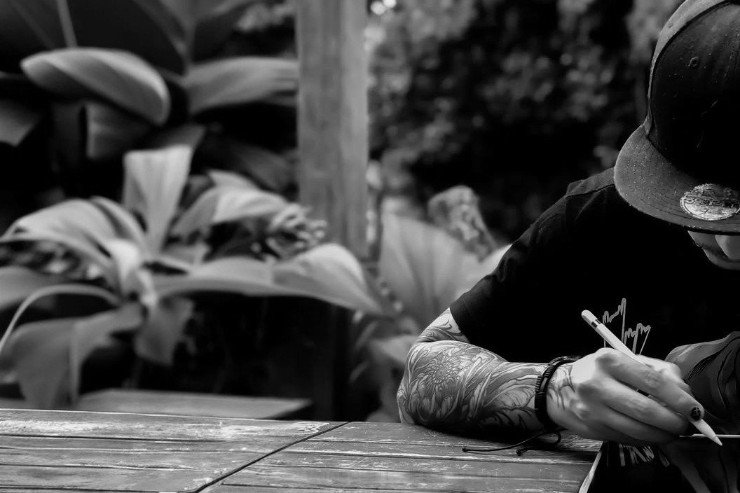 Tattoo artist working